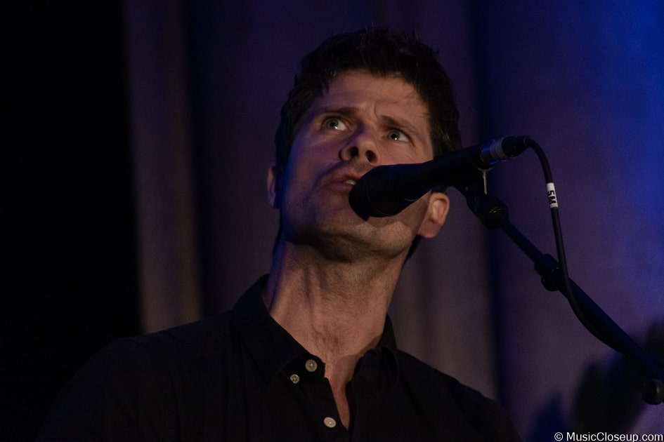 Seth Lakeman singing and glancing upwards